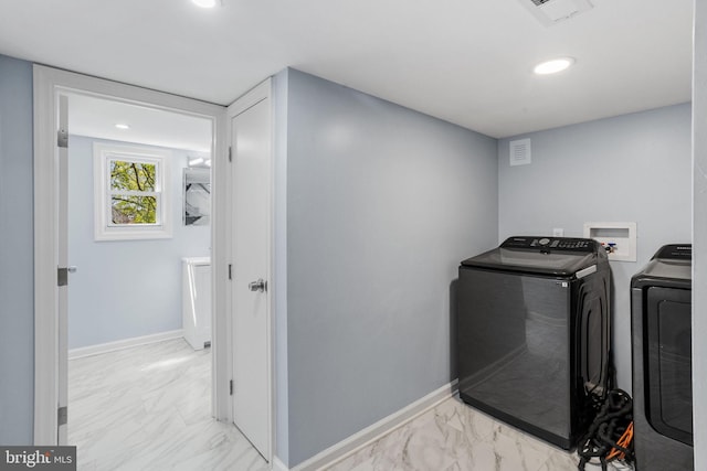 clothes washing area featuring washing machine and dryer, marble finish floor, laundry area, and visible vents