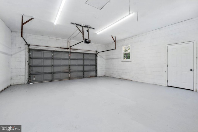 garage featuring a garage door opener
