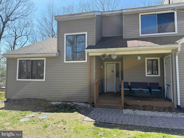 3301 Windermere Dr, Bushkill, PA 18324 - view of front of home with an outdoor hangout area, a shingled roof, and covered porch