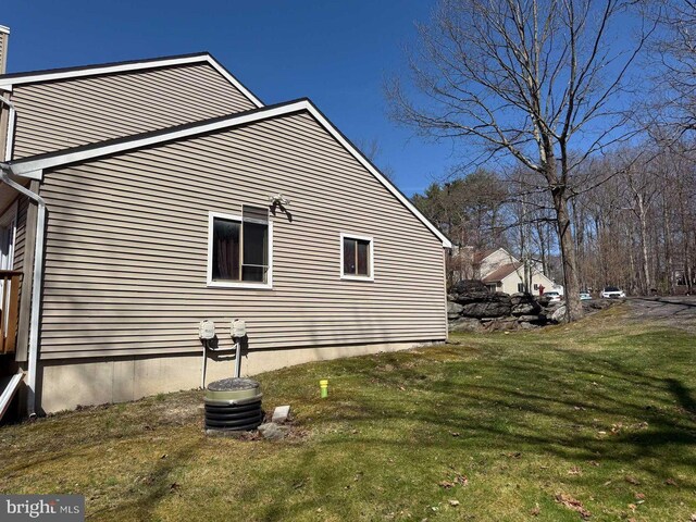 3301 Windermere Dr, Bushkill, PA 18324 - view of side of property with a yard and a chimney