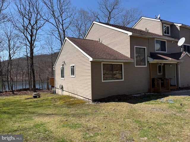 3301 Windermere Dr, Bushkill, PA 18324 - rear view of property with a yard and a shingled roof