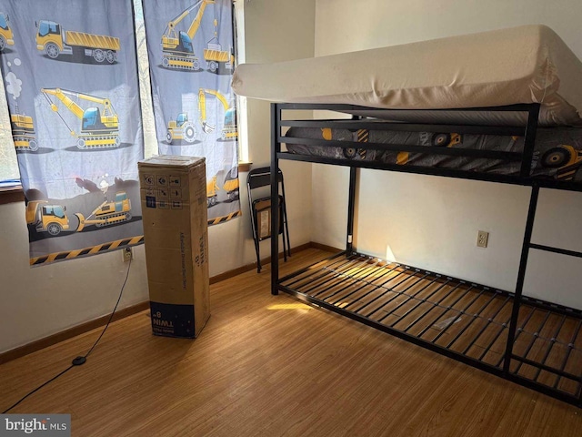 3301 Windermere Dr, Bushkill, PA 18324 - bedroom featuring baseboards and wood finished floors