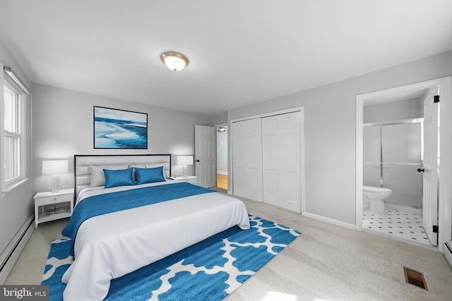 413 Bucktoe Rd, Avondale, PA 19311 - carpeted bedroom with a baseboard radiator, baseboards, a closet, and ensuite bath