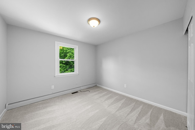 413 Bucktoe Rd, Avondale, PA 19311 - empty room with carpet floors, a baseboard heating unit, and baseboards