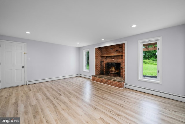 413 Bucktoe Rd, Avondale, PA 19311 - unfurnished living room with a baseboard heating unit, healthy amount of natural light, wood finished floors, and recessed lighting