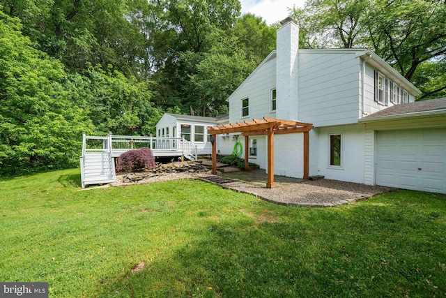 413 Bucktoe Rd, Avondale, PA 19311 - back of house with a pergola, a chimney, an attached garage, a wooden deck, and a yard