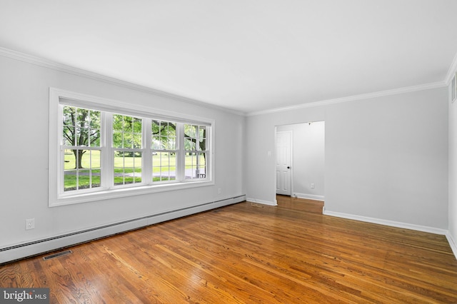 413 Bucktoe Rd, Avondale, PA 19311 - spare room with a baseboard heating unit, wood finished floors, crown molding, and baseboards