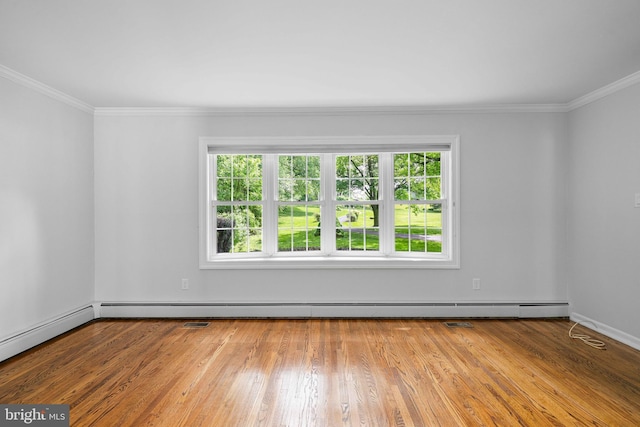 413 Bucktoe Rd, Avondale, PA 19311 - empty room featuring ornamental molding, wood finished floors, baseboards, and a baseboard radiator