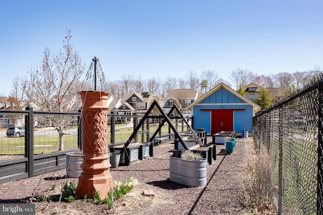 view of playground featuring fence and an outbuilding