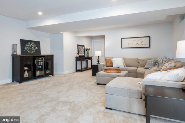 living room with baseboards, light colored carpet, and recessed lighting