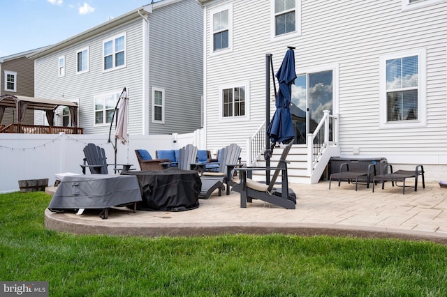 back of house featuring entry steps and a patio area