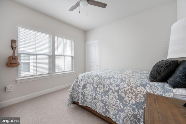 bedroom featuring carpet floors, baseboards, and ceiling fan