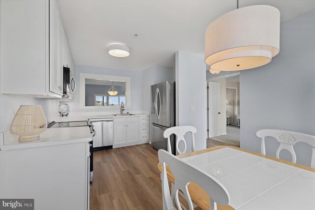 dining space featuring dark wood-style flooring