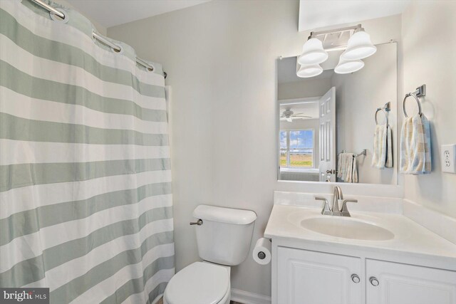 bathroom with vanity, a shower with curtain, and toilet