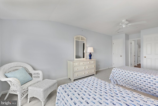 carpeted bedroom featuring baseboards, ceiling fan, and lofted ceiling