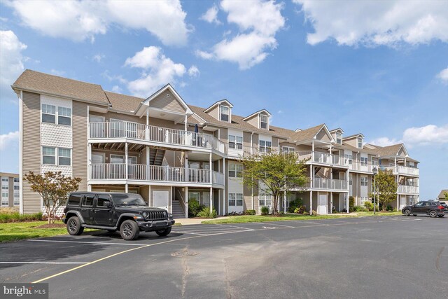 view of property with uncovered parking