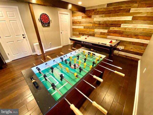rec room with wood walls, hardwood / wood-style flooring, recessed lighting, and baseboards