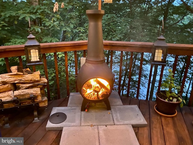 balcony with a warm lit fireplace