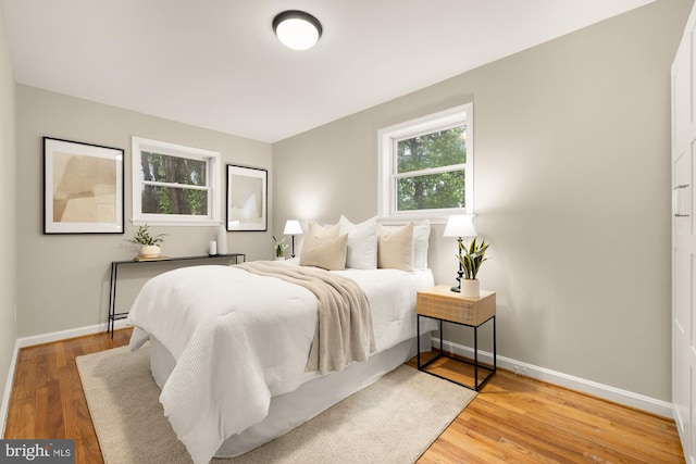 909 Snure Rd, Silver Spring, MD 20901 - bedroom with baseboards and wood finished floors