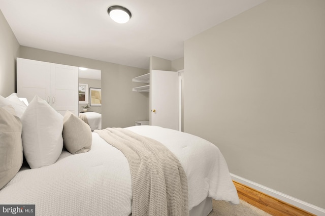 909 Snure Rd, Silver Spring, MD 20901 - bedroom with light wood-style flooring and baseboards