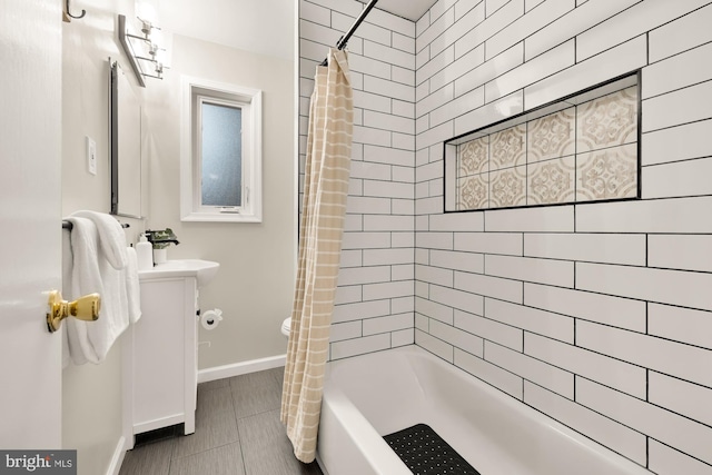 909 Snure Rd, Silver Spring, MD 20901 - bathroom with vanity, shower / tub combo with curtain, baseboards, and toilet