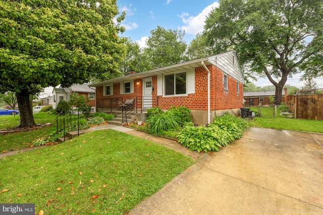 909 Snure Rd, Silver Spring, MD 20901 - view of front of home with brick siding and a chimney