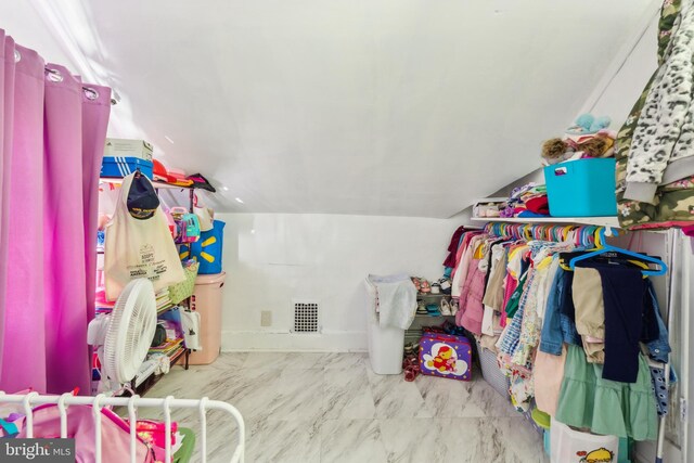 walk in closet featuring marble finish floor and visible vents