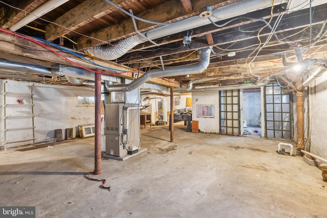 unfinished below grade area featuring heating unit