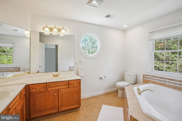 full bath featuring double vanity, a garden tub, toilet, and a sink