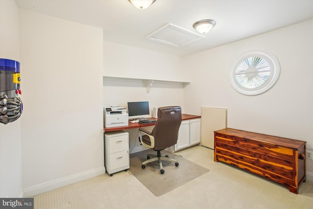 office area with baseboards, attic access, and light carpet