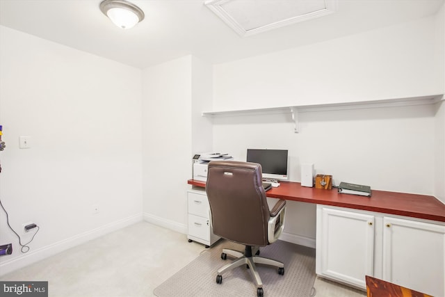 home office with light carpet and baseboards