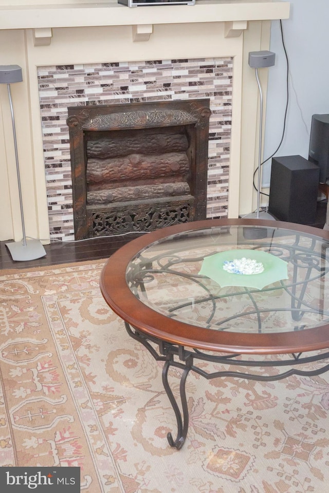 details with a tiled fireplace