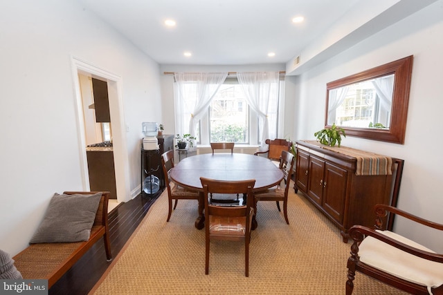 dining space with recessed lighting, light wood-style flooring, and a wealth of natural light