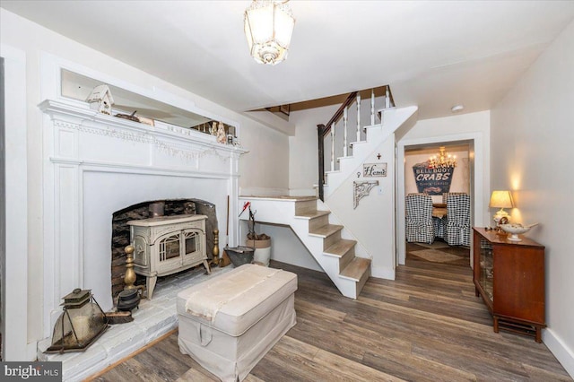 15539 Liberty Rd, Mount Airy, MD 21771 - living area featuring stairway, wood finished floors, a notable chandelier, and a wood stove
