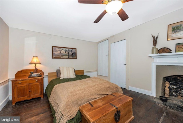 15539 Liberty Rd, Mount Airy, MD 21771 - bedroom featuring dark wood-style floors, a ceiling fan, baseboards, and a fireplace