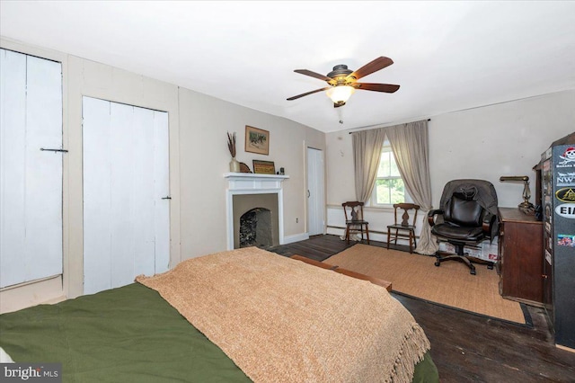 15539 Liberty Rd, Mount Airy, MD 21771 - bedroom featuring dark wood finished floors, ceiling fan, and a fireplace