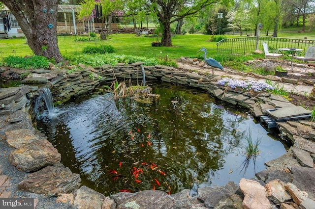 15539 Liberty Rd, Mount Airy, MD 21771 - dock area featuring a garden pond, a yard, and fence
