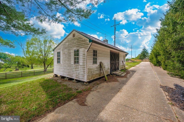 15539 Liberty Rd, Mount Airy, MD 21771 - view of side of home with a chimney, fence, and a yard