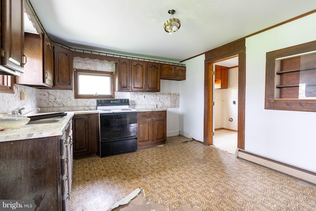 kitchen featuring a sink, range with electric cooktop, dark brown cabinetry, light countertops, and a baseboard radiator