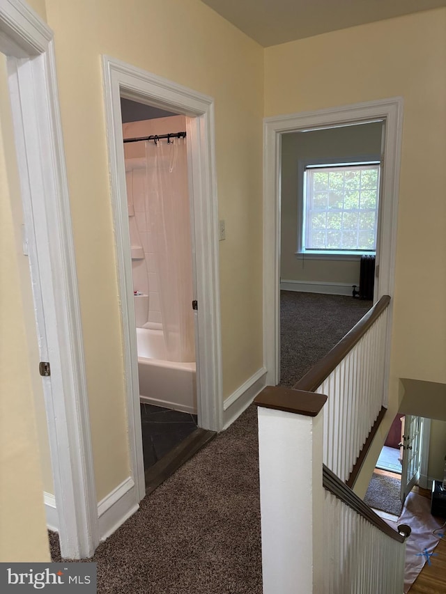 1994 Upland Way, Philadelphia, PA 19131 - hallway with carpet floors, baseboards, and an upstairs landing