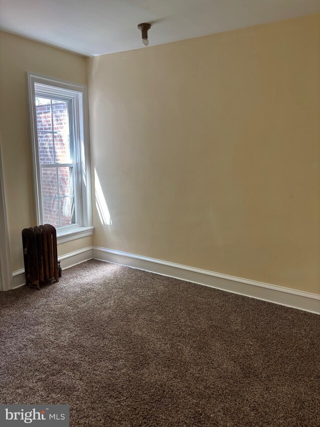1994 Upland Way, Philadelphia, PA 19131 - unfurnished room featuring radiator heating unit, baseboards, and carpet