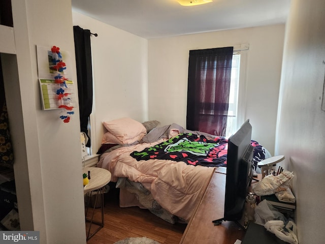 bedroom featuring wood finished floors