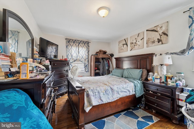 bedroom with wood finished floors