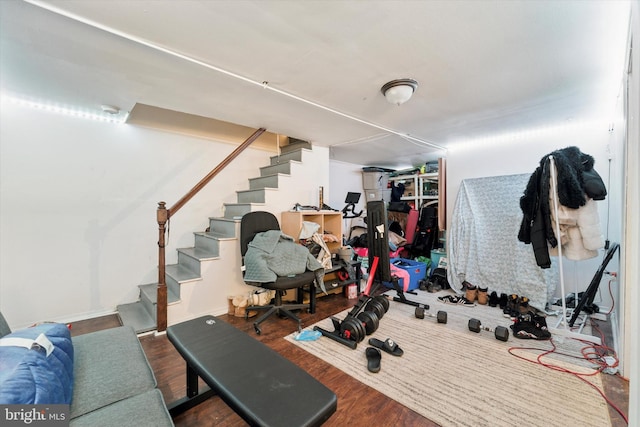 workout area with wood finished floors