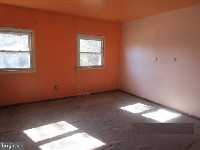 empty room featuring carpet flooring