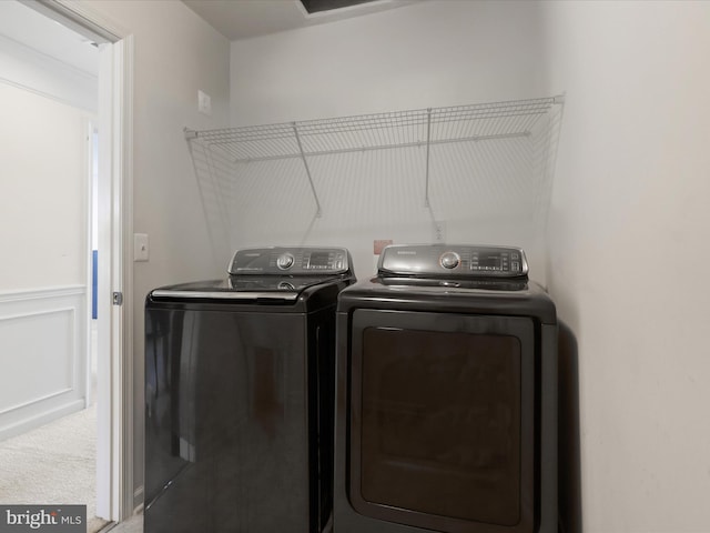 laundry area with separate washer and dryer and laundry area