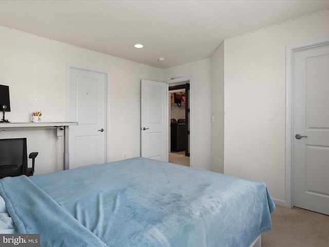 bedroom featuring light carpet and recessed lighting