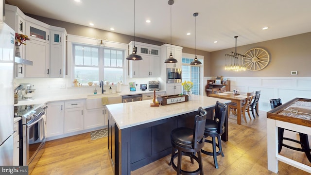 219 Pepper Ridge Dr, Spring Mills, PA 16875 - kitchen featuring appliances with stainless steel finishes, white cabinetry, and a sink