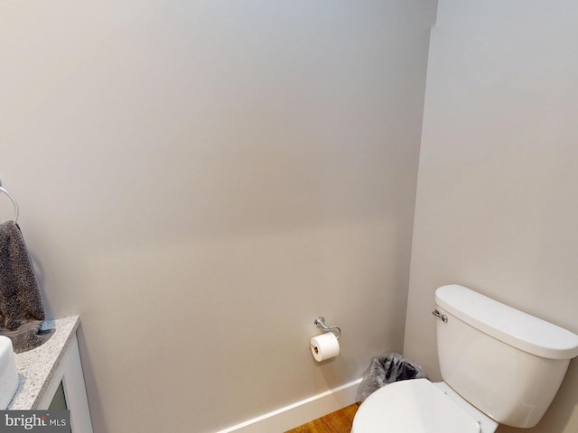 219 Pepper Ridge Dr, Spring Mills, PA 16875 - bathroom with toilet, vanity, wood finished floors, and baseboards