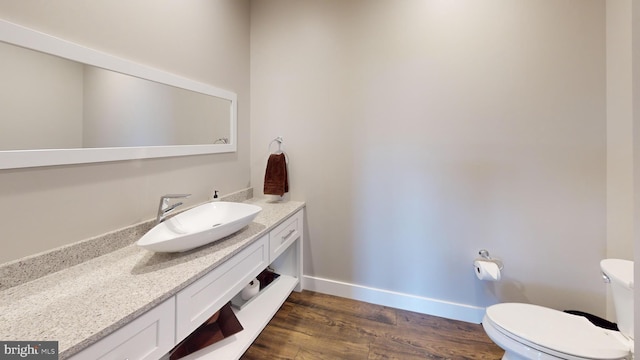 219 Pepper Ridge Dr, Spring Mills, PA 16875 - half bath with wood finished floors, toilet, vanity, and baseboards